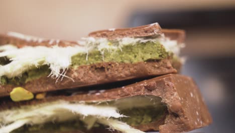 mouth-watering dubai chocolate enriched with green pistachio sprinkles in a detailed macro view