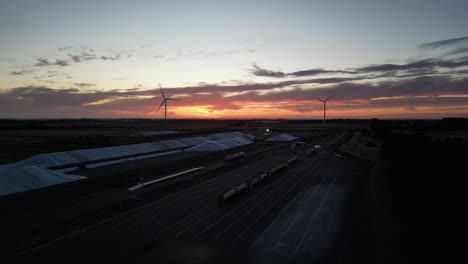 aerial view of a grain storage site powered by wind turbines in western australia