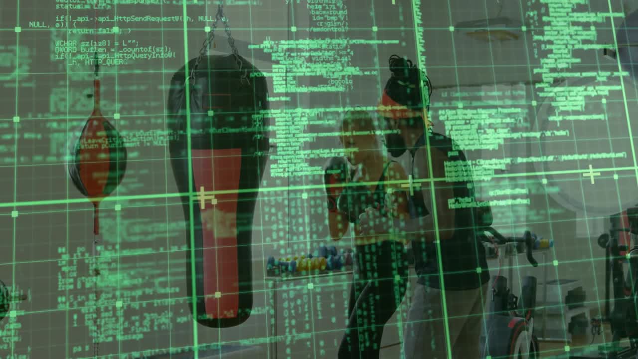 female trainee punching heavy bag by dumbbell rack with coach guiding, displaying fitness code grid