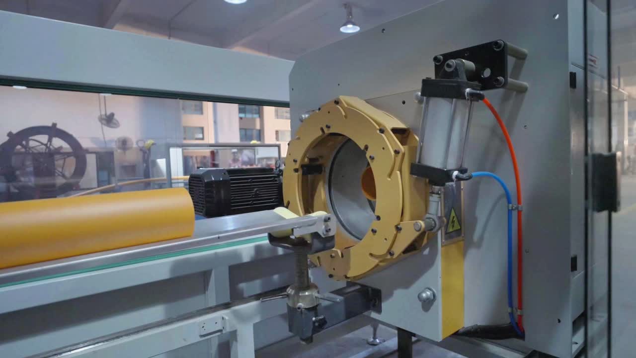 Sophisticated piece of industrial machinery is running, processing materials in a modern factory setting