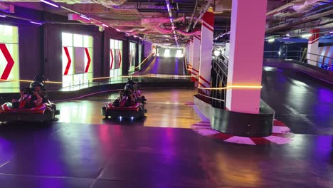 indoor go-karting track with neon lights