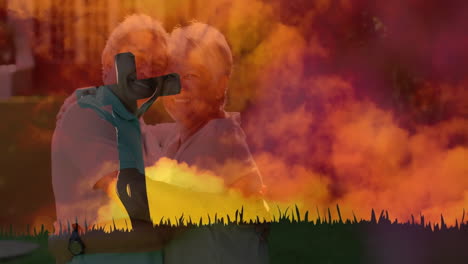 elderly couple embracing with colorful sunset and silhouette animation overlay