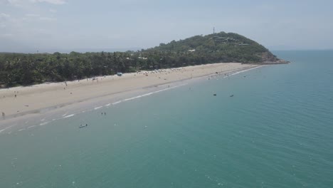 Tourists-Enjoying-Four-Mile-Beach-At-Summer-in-Port-Douglas,-QLD,-Australia