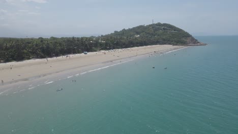 tourists enjoying four mile beach at summer in port douglas, qld, australia