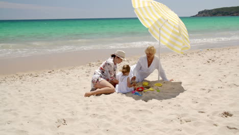 family having great time on the beach