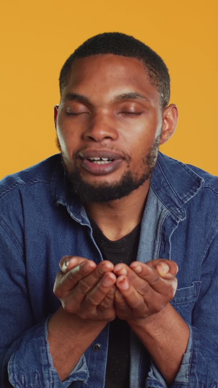 Happy Man Smelling Fresh Coffee Beans in Studio