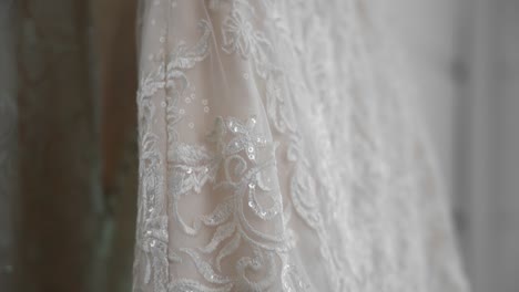 Gorgeous-close-up-of-the-details-in-the-fabric-of-a-elegant-white-wedding-gown