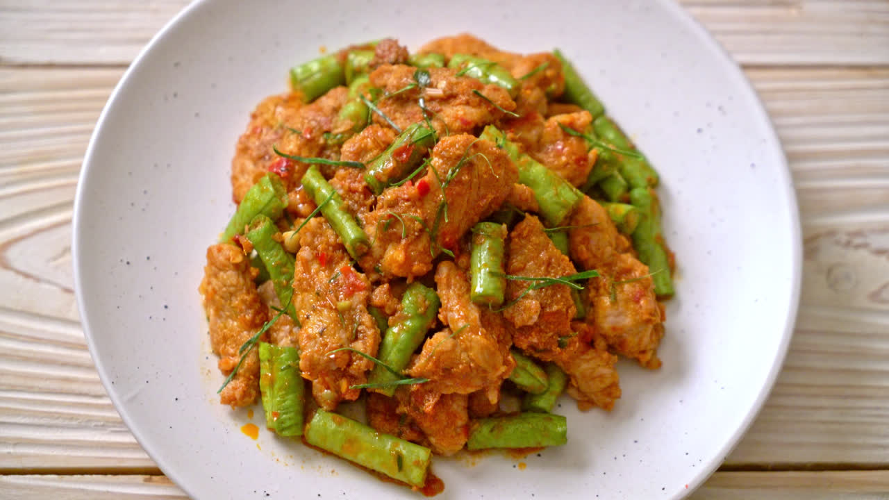 Stir fried pork and red curry paste with sting bean - Asian food style