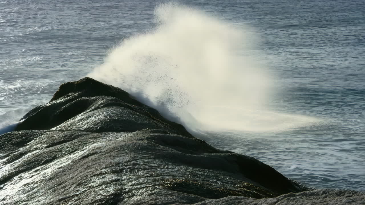 Waves crashing against a rocky jetty