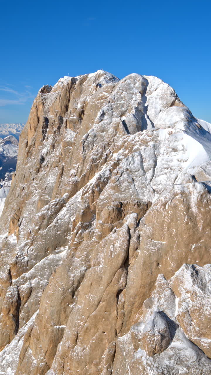 View of snow on the mountains in the Dolomites, Italy. Vertical