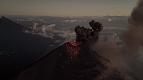 lava explodes from fuego volcano, aerial orbit view