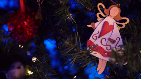 decorative star and angel hanging on christmas tree