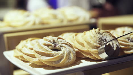 Dolly-shot-of-butter-cookies-at-a-luxury-hotel-breakfast-bar