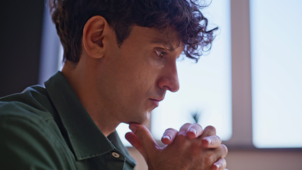 Professional writer pondering ideas working at home closeup. Serious freelancer