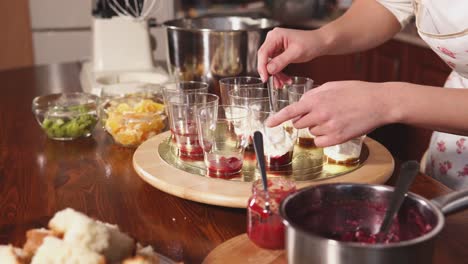 making a fruit trifle dessert