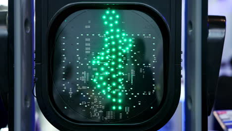 pedestrian traffic light displaying red stop and green walk signals