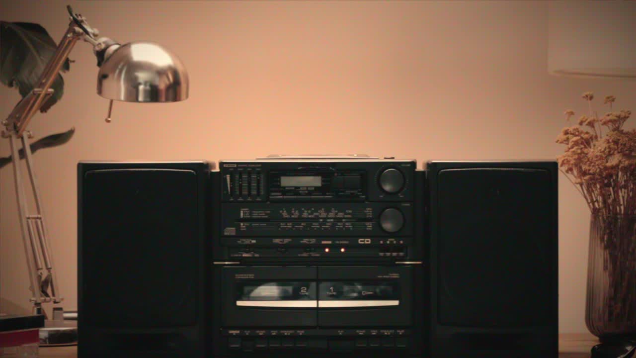 Retro radio tape recorder, audio cassette close-up. Listening to music, old radio boom box player, macro of vintage music listening. . High quality 4k footage