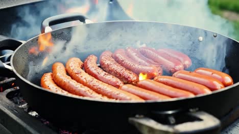 grilling sausages on a charcoal grill