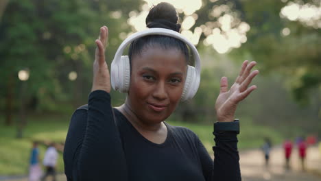 woman exercising with headphones in the park