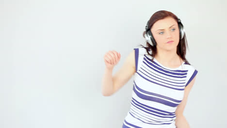 dancing pretty brunette listening to music