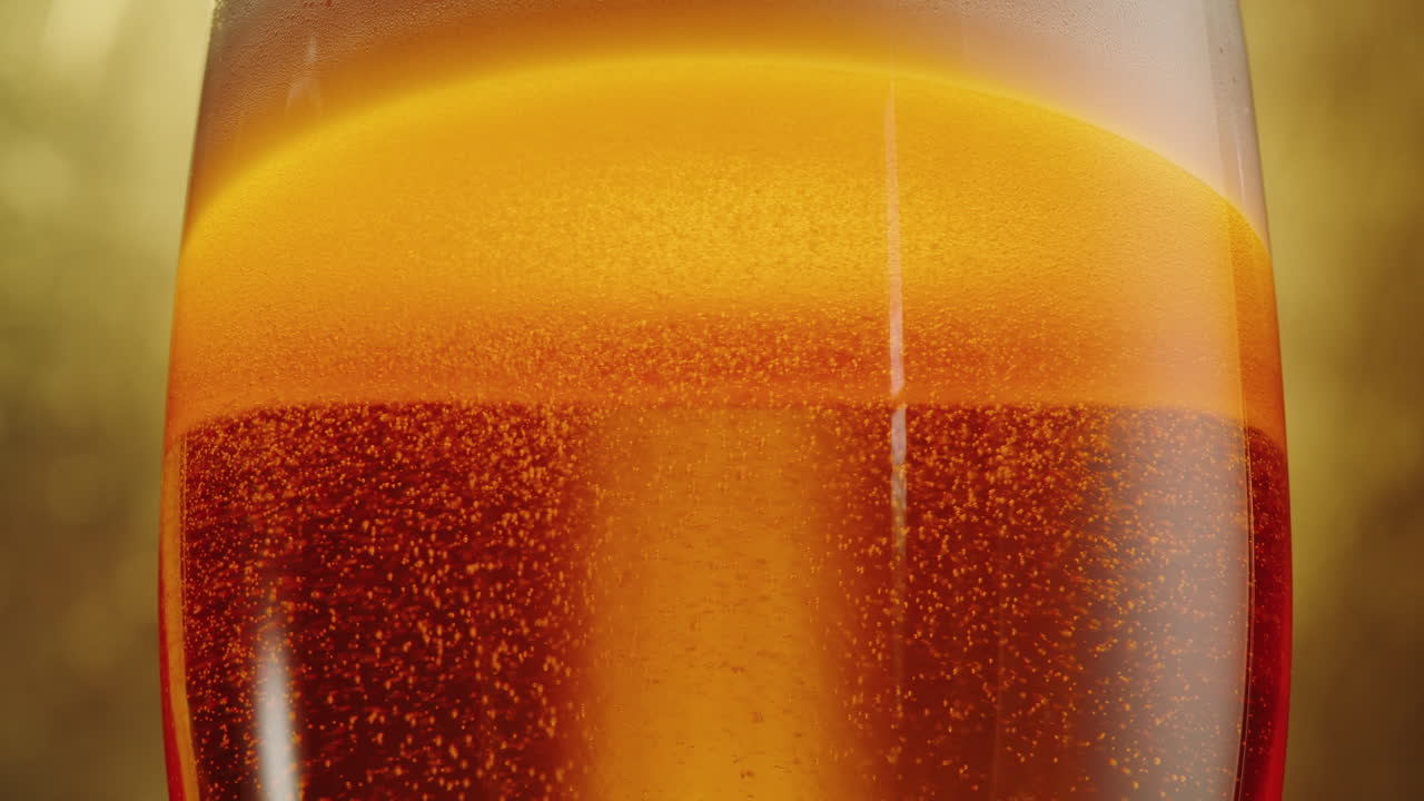 Close-up of a glass of beer with bubbles