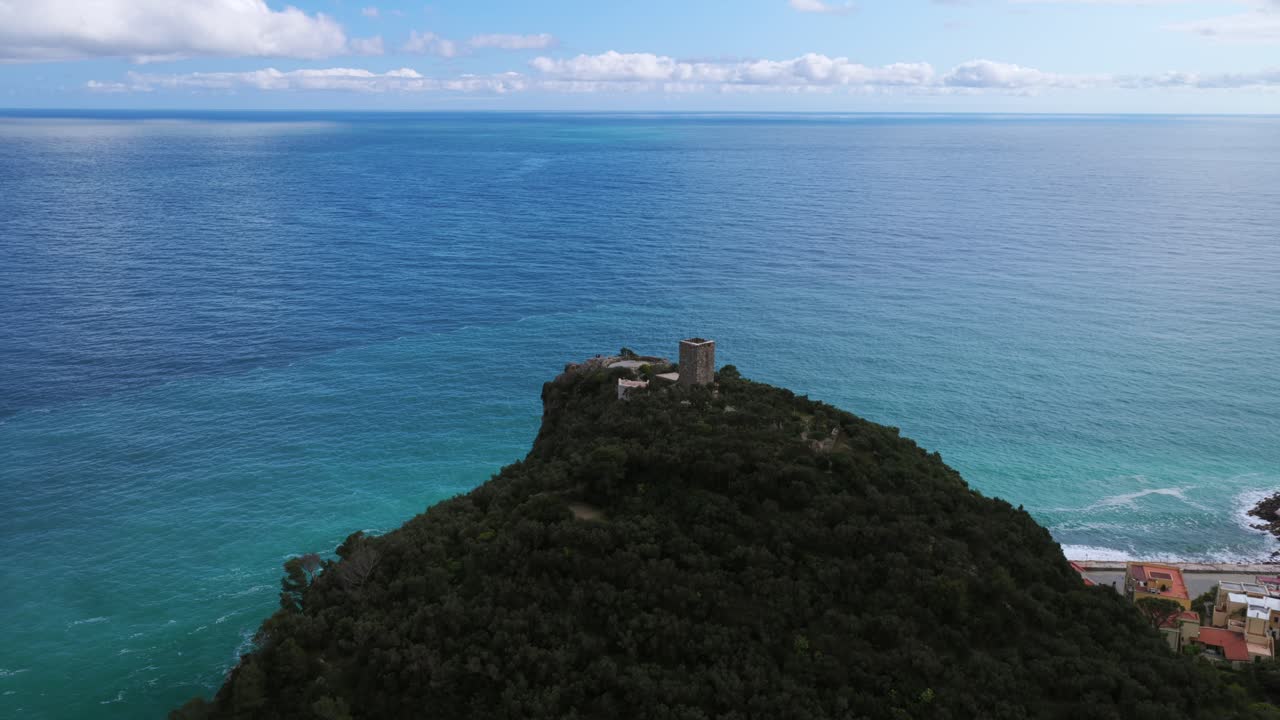 Aerial View Of Torre Saracena - Historical Tower In Varigotti, Liguria Region Of Italy. ascending tilt-down shot