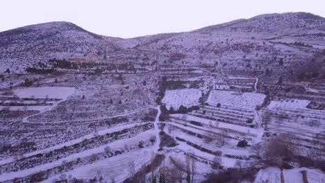 drone-flying-over-snowy-mountain-in-spain