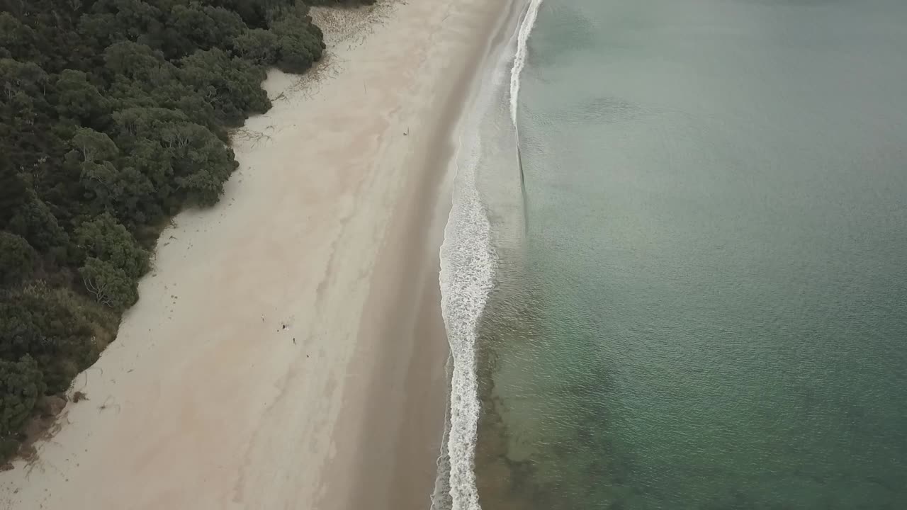 Calm waves on a beach in New Zealand in the Bay Of Islands
