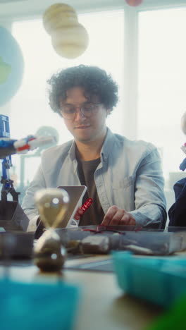 students working on robotics projects in a classroom