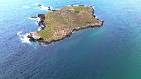 aerial view of rugged coast line with blue ocean and waves crashing, portugal, 4k