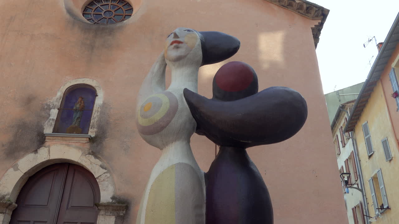 Vallauris, France - March 19, 2025: Street sculpture by Roger Capron near a church in daylight