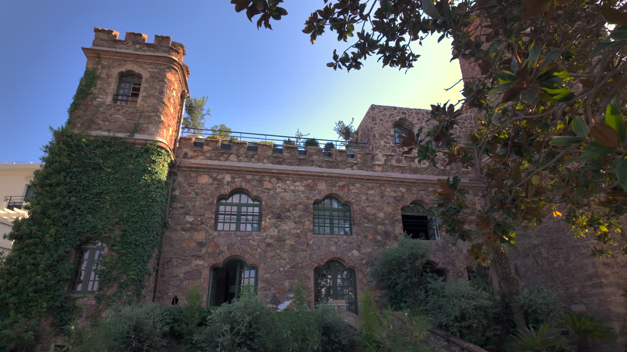 View of the facade of the Chateau de Theoule-sur-Mer surrounded by greenery in France