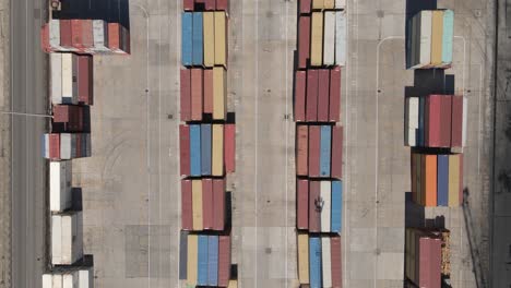 Vertical-flyover-of-freight-containers-stacked-in-Durres-Port,-Albania