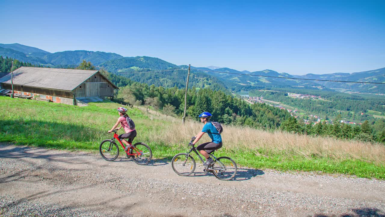 Fit Cyclist Couple Stop To Admire Beautiful Landscape. Pohorje Hills, Vuzenica, Slovenia