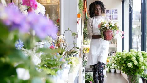 florist with pot flower walking in flower shop 4k