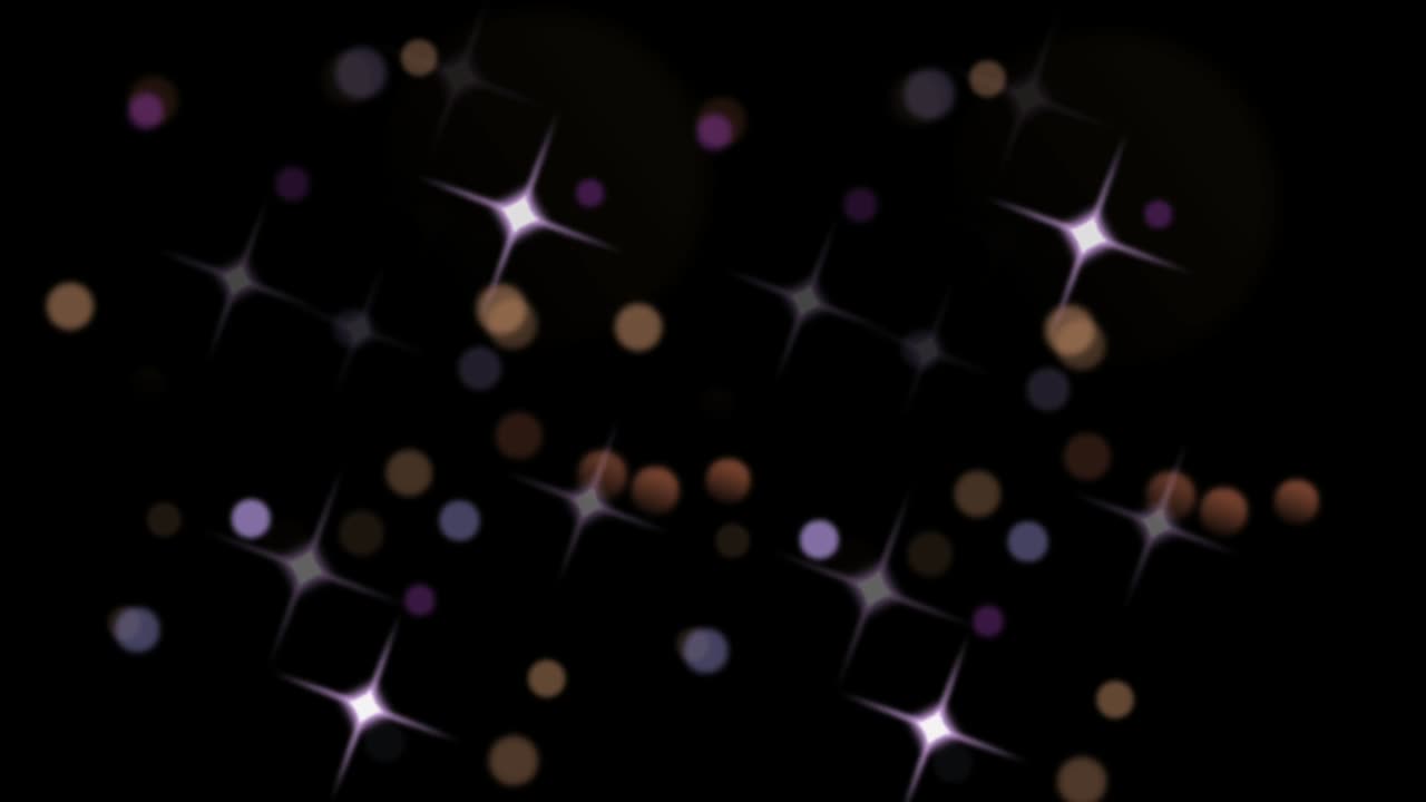 Animation orange light sparkles on black background.