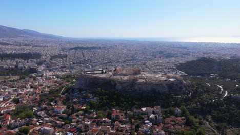 wide circling aerial shot of the athens acropolis side profile