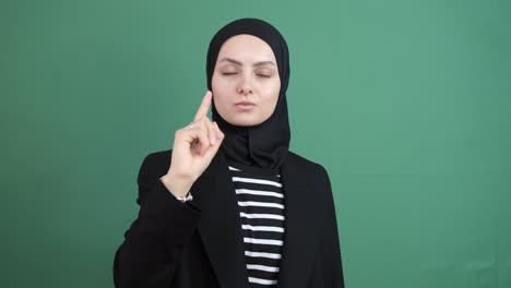 muslim girl wagging finger