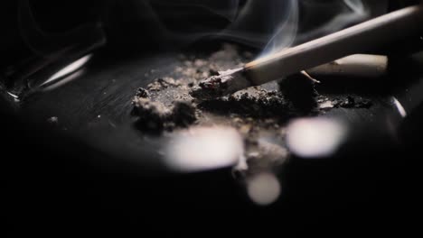 close up smoking cigarette on man hand