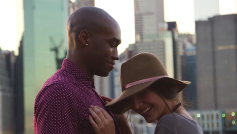 romantic young couple with manhattan skyline in background