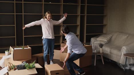 spouses relocating to new dwelling, carrying boxes, swirling enjoy move