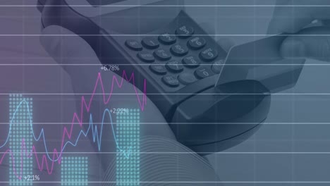 Financial-data-processing-against-close-up-of-person's-hand-using-a-card-machine