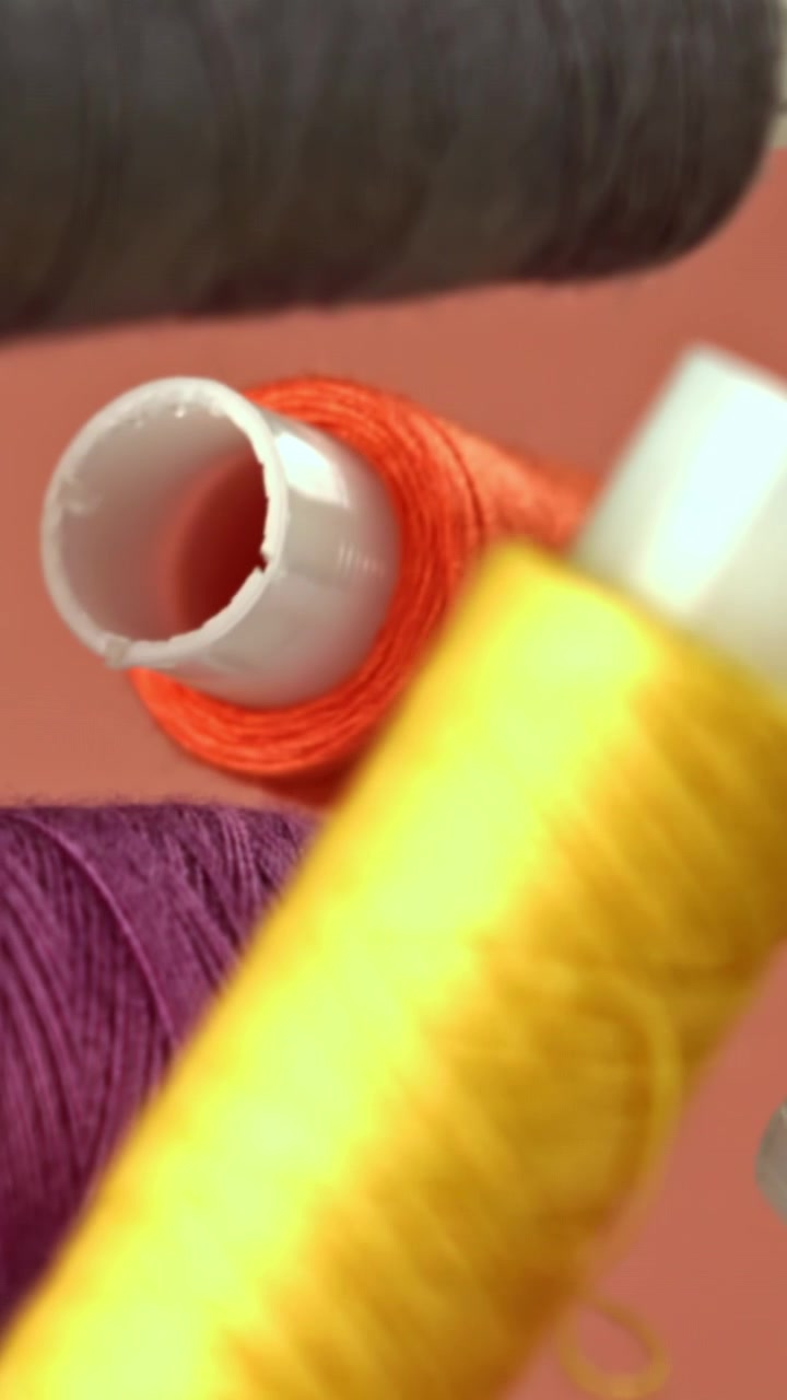 Close-Up View of Various Colored Sewing Threads