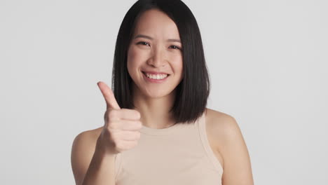 Asian-woman-pointing-straight-to-the-camera.