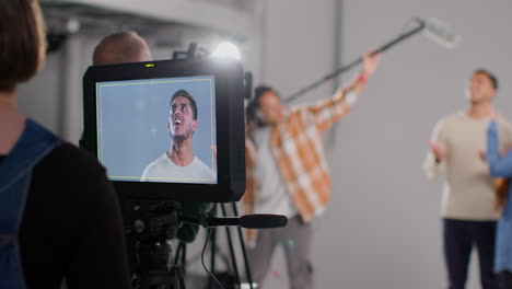 Frustrated-Actors-Shooting-Movie-Or-Video-Scene-In-Studio-as-Sound-Recordist-Drops-Microphone-Into-Shot