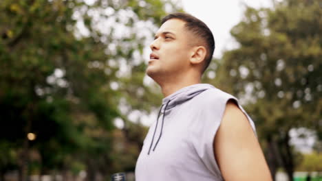 Fitness,-runner-and-man-drinking-water-in-a-park