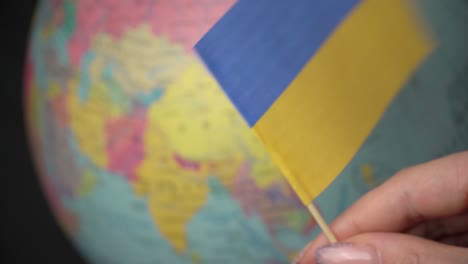 flag of ukraine on the background of the globe