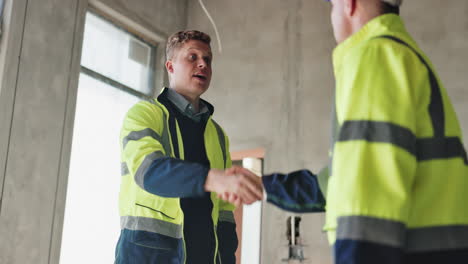 construction workers handshake