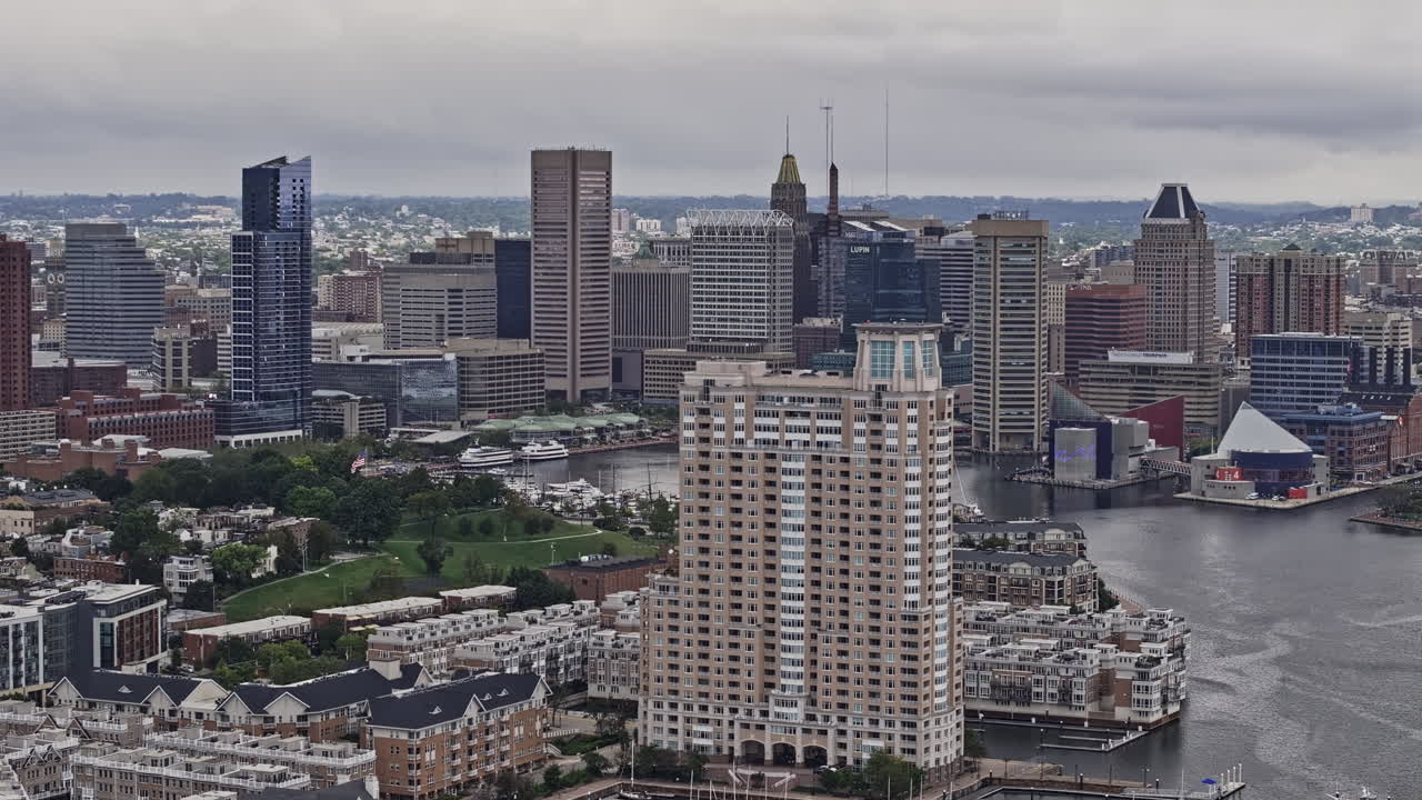 Baltimore Maryland Aerial v90 zoomed flyover riverside neighborhood capturing Inner Harbor and downtown cityscape across Patapsco river on an overcast day - Shot with Mavic 3 Pro Cine - Sept 28th 2023