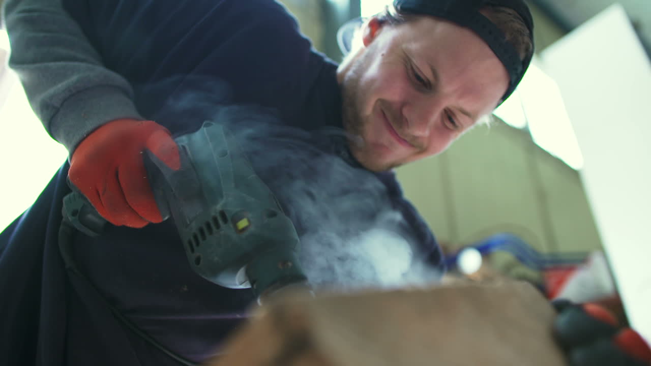 Carpenter Using Drill Machine On Wood 1